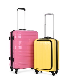 Stylish suitcases packed for travel on white background. Summer vacation
