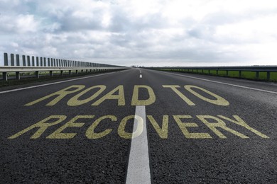 Start to live without alcohol addiction. Phrase ROAD TO RECOVERY on asphalt highway