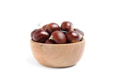 Fresh sweet edible chestnuts in wooden bowl on white background