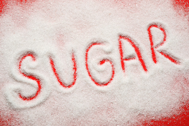 Photo of Composition with word SUGAR on red background, top view