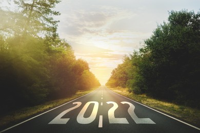 Start new year with fresh vision and ideas. 2022 numbers on asphalt road