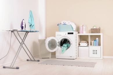 Washing machine with towels in laundry room interior