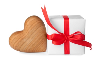 Beautiful gift box and toy heart on white background. Valentine's day celebration