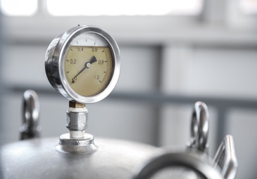 Photo of Pressure gauge at modern granary, closeup. Space for text