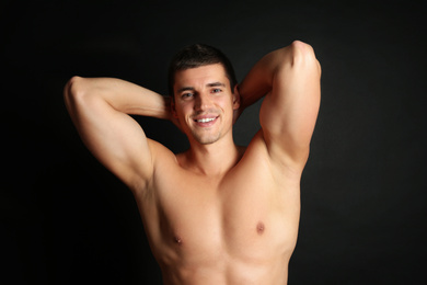 Man with sexy body on black background