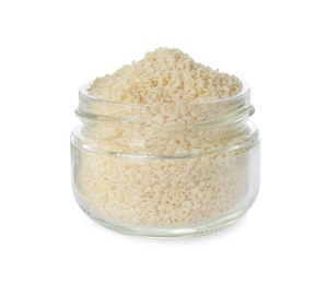 Glass jar with sesame seeds on white background