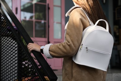 Woman with stylish white backpack on city street, closeup