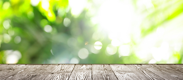 Empty wooden surface against blurred background. Bokeh effect