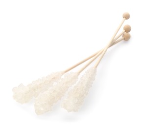 Wooden sticks with sugar crystals isolated on white. Tasty rock candies