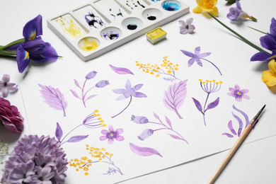 Composition with watercolor paints and floral picture on white background