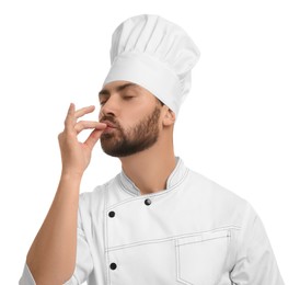Photo of Mature chef showing delicious gesture on white background