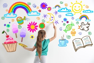Cute child girl drawing of colorful dye many different picture on white wall
