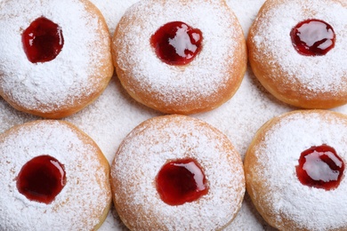 Hanukkah doughnuts with jelly and sugar powder, flat lay