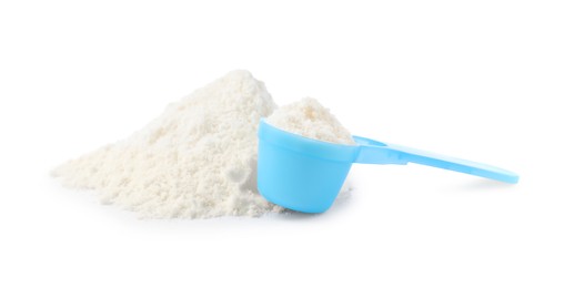 Powdered infant formula and scoop  on white background. Baby milk