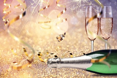 Glasses and bottle of sparkling wine on bright festive background, banner design