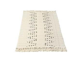 Light rug with tassels isolated on white