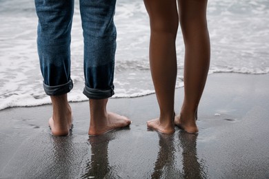 Young couple on beach near sea, closeup