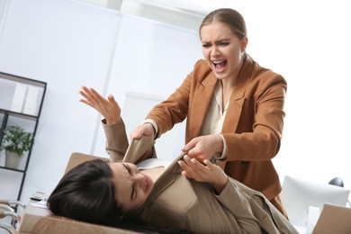 Emotional colleagues fighting in office. Workplace conflict