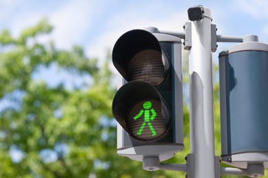Pedestrian traffic light outdoors, space for text