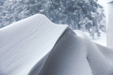 Beautiful snowdrift outdoors, closeup view/ Winter season