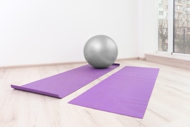 Ball and yoga mats in physiotherapy gym