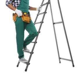Professional builder climbing up metal ladder on white background, closeup