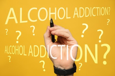 Alcohol addiction? - We can help you. Closeup view of man with pen against yellow background