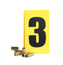 Shell casings and crime scene marker with number three isolated on white