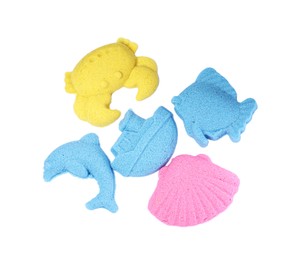 Marine inhabitants and ship made of kinetic sand on white background, top view