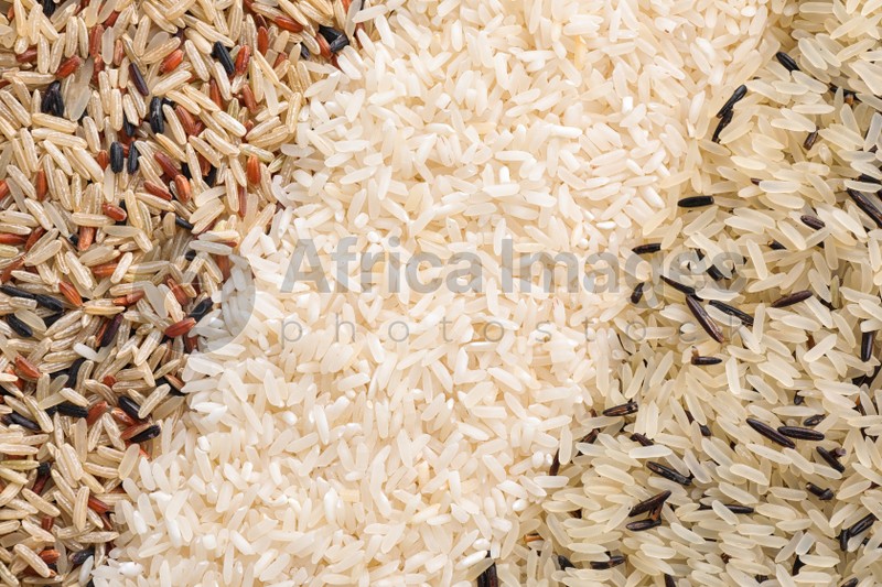 Different types of rice as background, top view