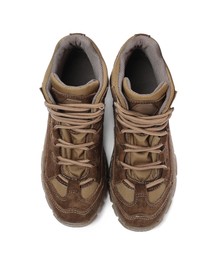 Photo of Pair of comfortable hiking boots on white background, top view. Camping tourism