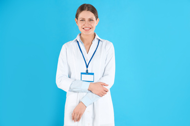 Photo of Portrait of young doctor on blue background