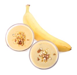 Tasty banana smoothie with almond and fresh fruit on white background, top view