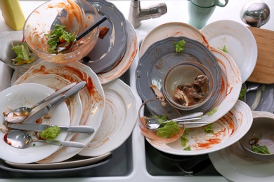Dirty dishes in sink after new year party