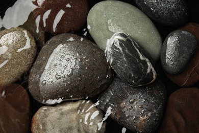 Pile of stones in water as background, top view. Zen lifestyle