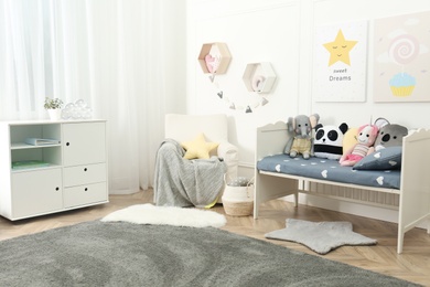 Child room interior with toys and stylish furniture