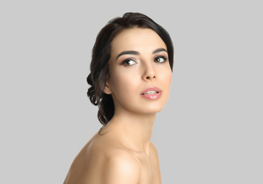 Image of Young woman with beautiful face on light background