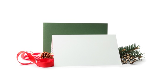 Blank greeting cards and Christmas decor on white background, space for text
