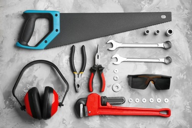Flat lay composition with different construction tools on grey background