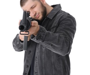 Assault gun. Man aiming rifle against white background, focus on muzzle
