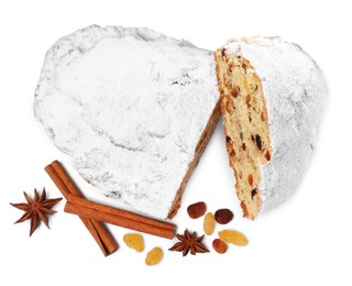 Cut delicious Stollen sprinkled with powdered sugar and ingredients on white background, top view