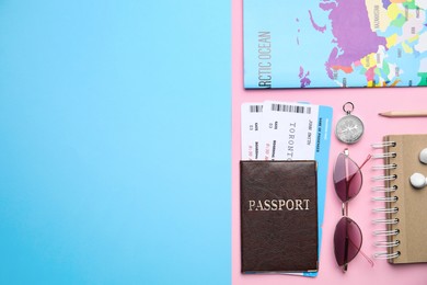 Flat lay composition with passport, tickets and travel items on color background. Space for text
