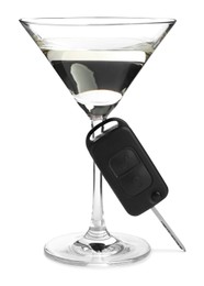 Glass of alcohol and car key on white background. Drunk driving concept