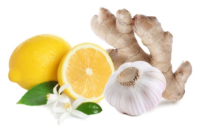 Image of Ginger root, garlic and lemon on white background