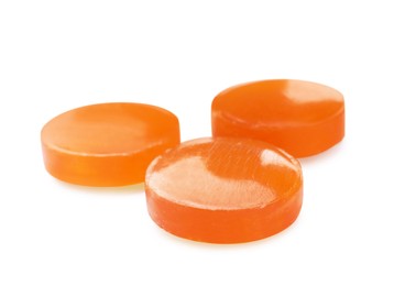 Orange cough drops on white background. Pharmaceutical product
