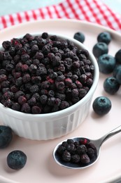 Freeze dried and fresh blueberries on table, closeup
