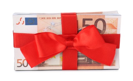 Euro banknotes tied with red ribbon isolated on white. Money and finance