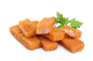 Fresh breaded fish fingers with parsley on white background