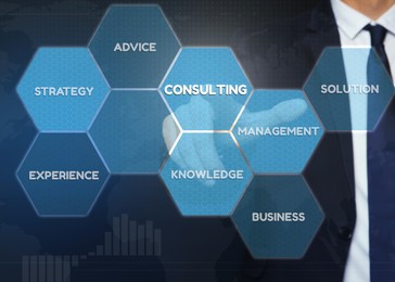 Consulting concept. Man pointing at icons on virtual screen, closeup