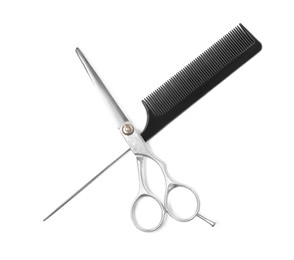 Professional hairdresser scissors and black comb isolated on white, top view. Haircut tools